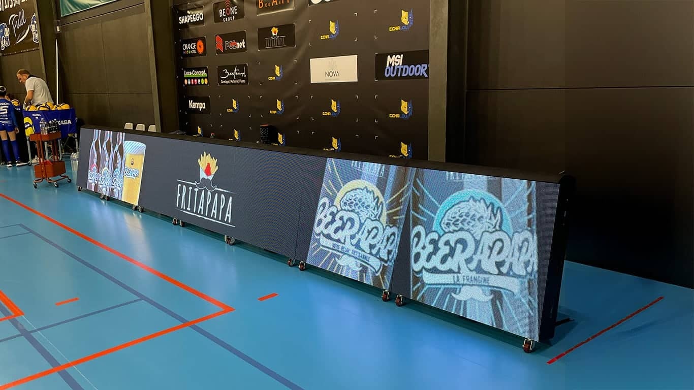 a large screen with a logo on it